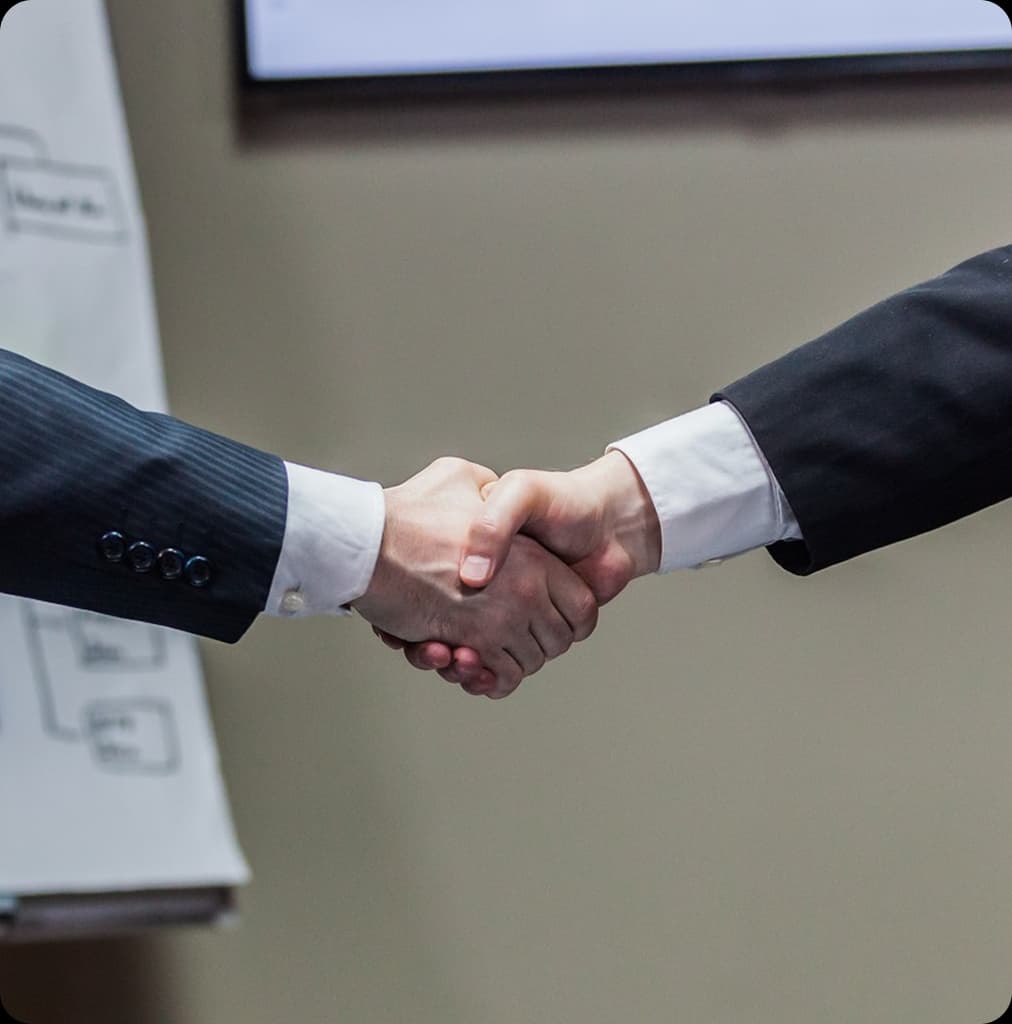 Colleagues discussing pricing and contracts